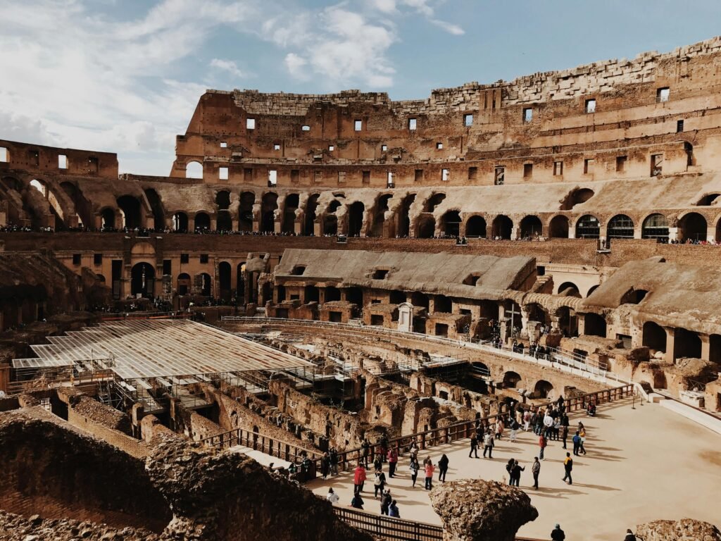 pexels-photo-2225443-2225443 View of the iconic Colosseum in Rome with tourists exploring the ancient amphitheater.