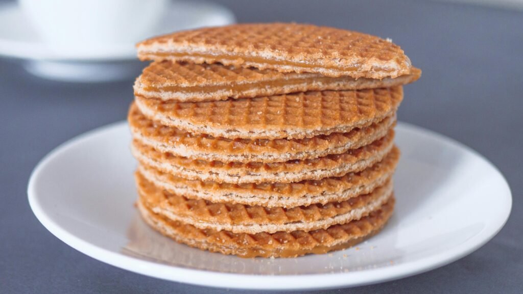 pexels-photo-6627267-6627267 Mouth-watering stack of stroopwafels on a white plate, perfect for a tasty treat.