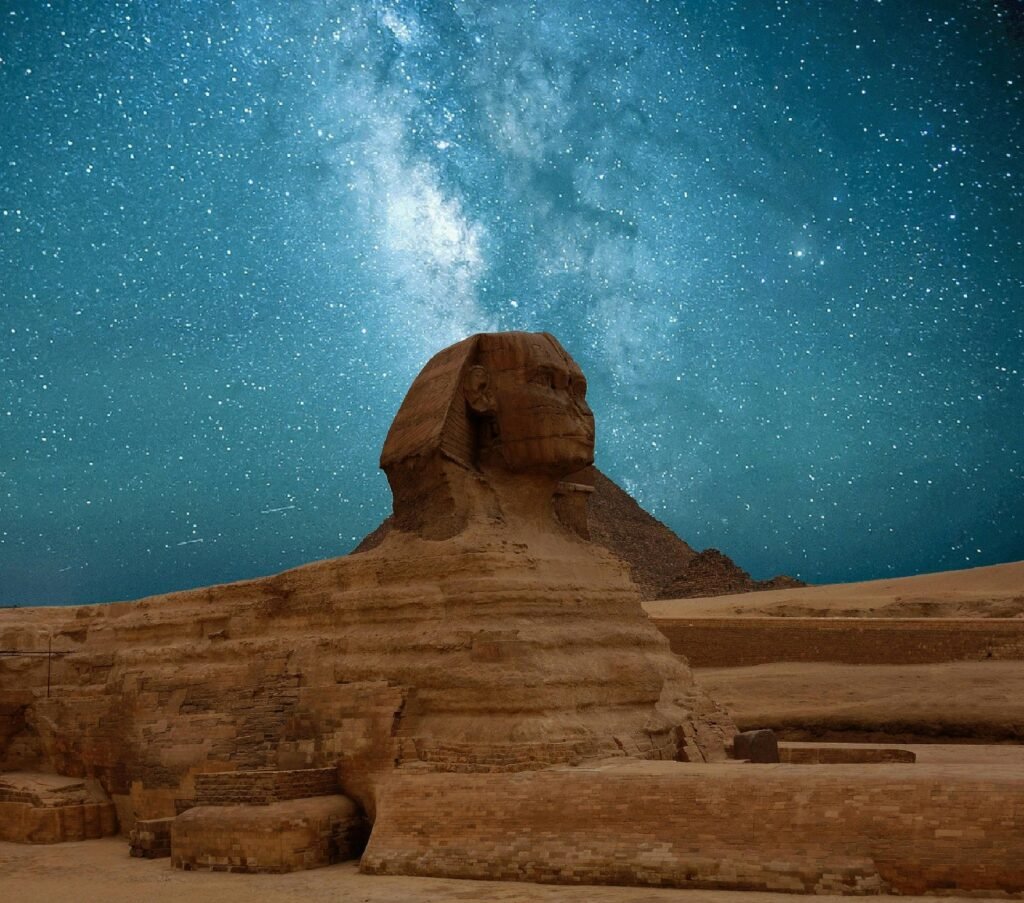 pexels-photo-262780-262780 The Great Sphinx of Giza beneath a captivating Milky Way night sky.