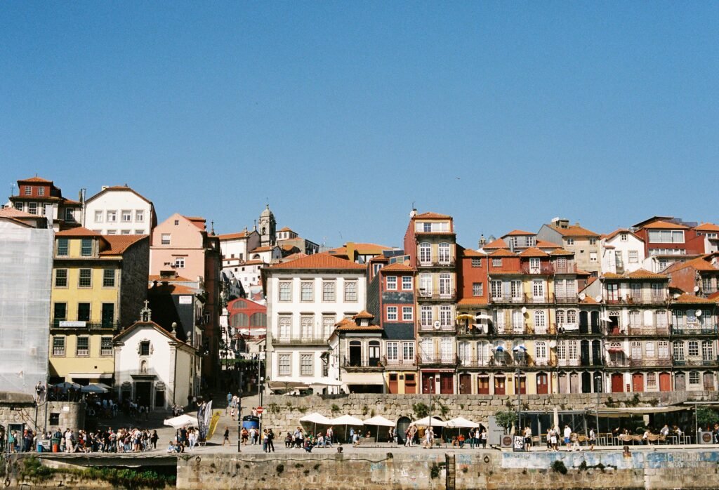 pexels-photo-28882396-28882396 Vibrant historical architecture along the Ribeira waterfront in Porto, Portugal.