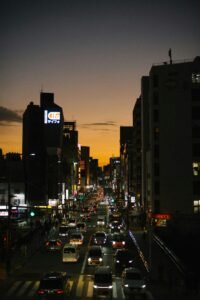 Bustling Tokyo street scene at sunset showcasing lively city life.