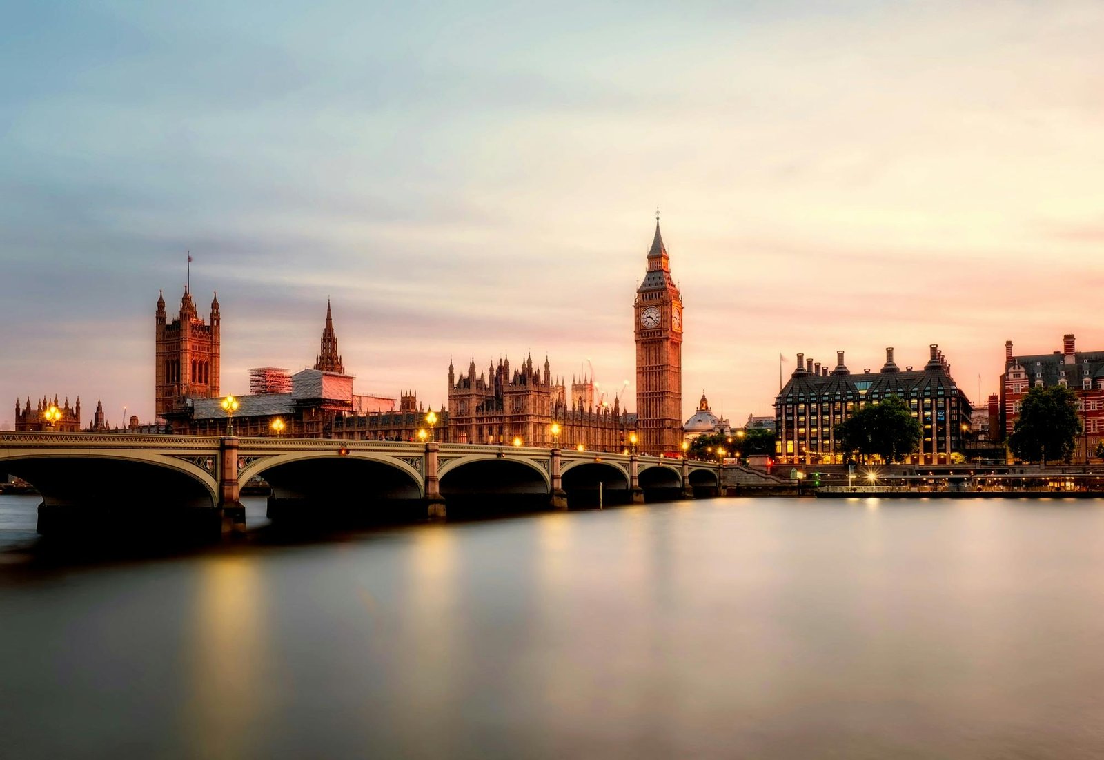 pexels-photo-460672-460672 Scenic view of Big Ben and Westminster Bridge over the Thames River at sunset in London, UK.