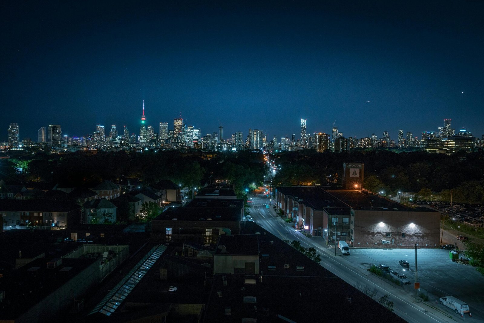 pexels-photo-4663142-4663142 A stunning nighttime view of Toronto featuring the illuminated CN Tower and city skyline.