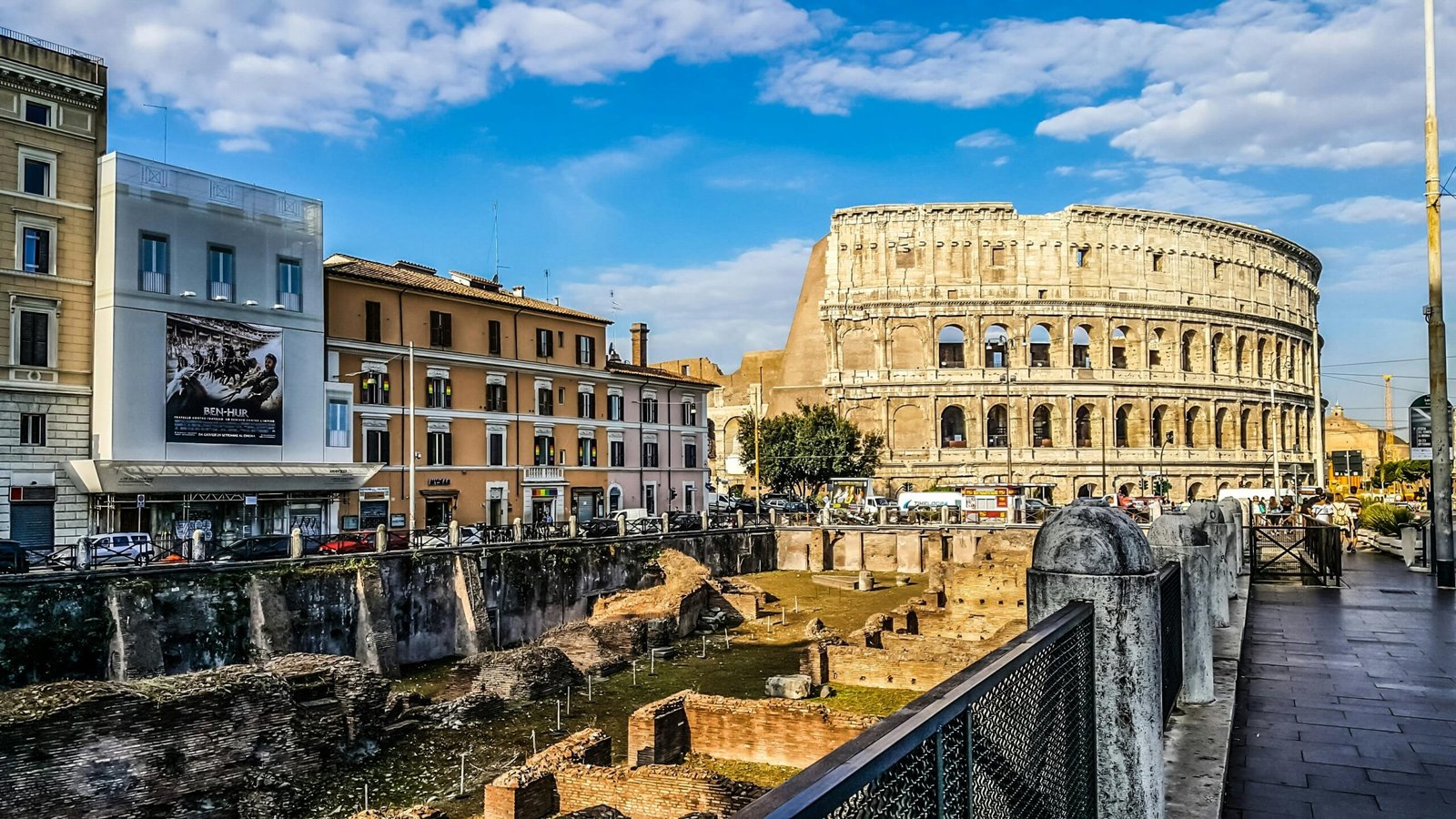 pexels-photo-532263-532263 Daylight view of the historic Colosseum in Rome with vibrant city buildings.
