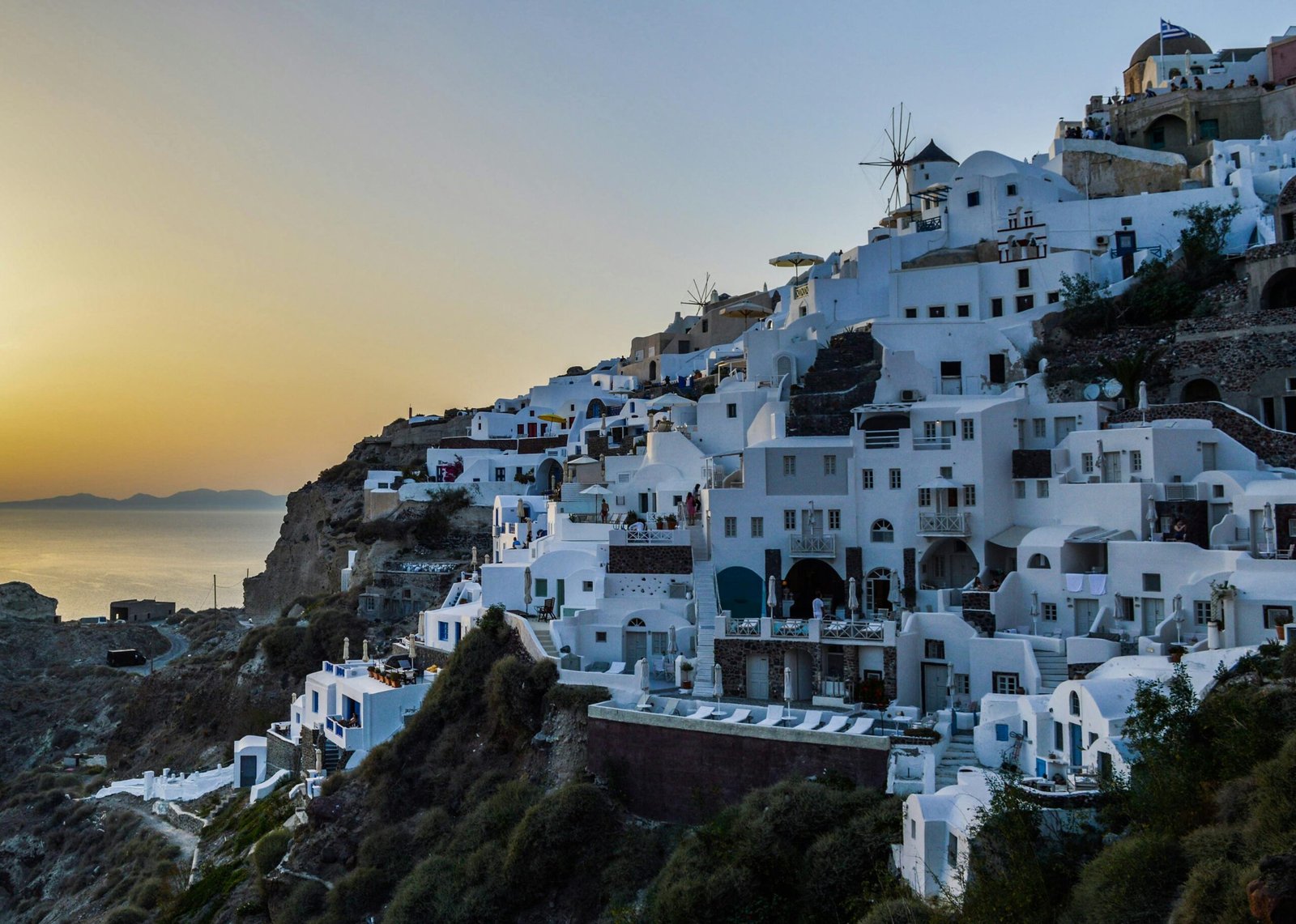 pexels-photo-1029115-1029115 Explore the iconic cliffside architecture of Santorini at sunset, capturing its serene beauty and picturesque charm.