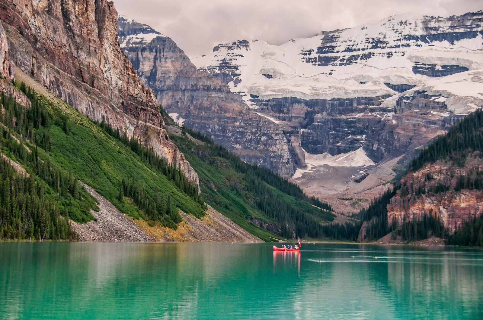 pexels-photo-1598072-1598072 Picturesque canoeing at Lake Louise, surrounded by stunning Rocky Mountains.