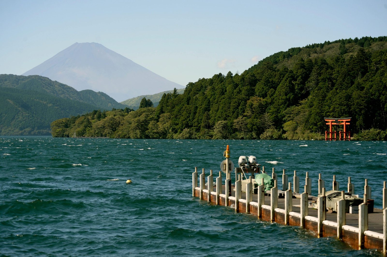 pexels-photo-16988346-16988346 Beautiful landscape of Mount Fuji by Lake Ashi with a serene pier and torii gate.