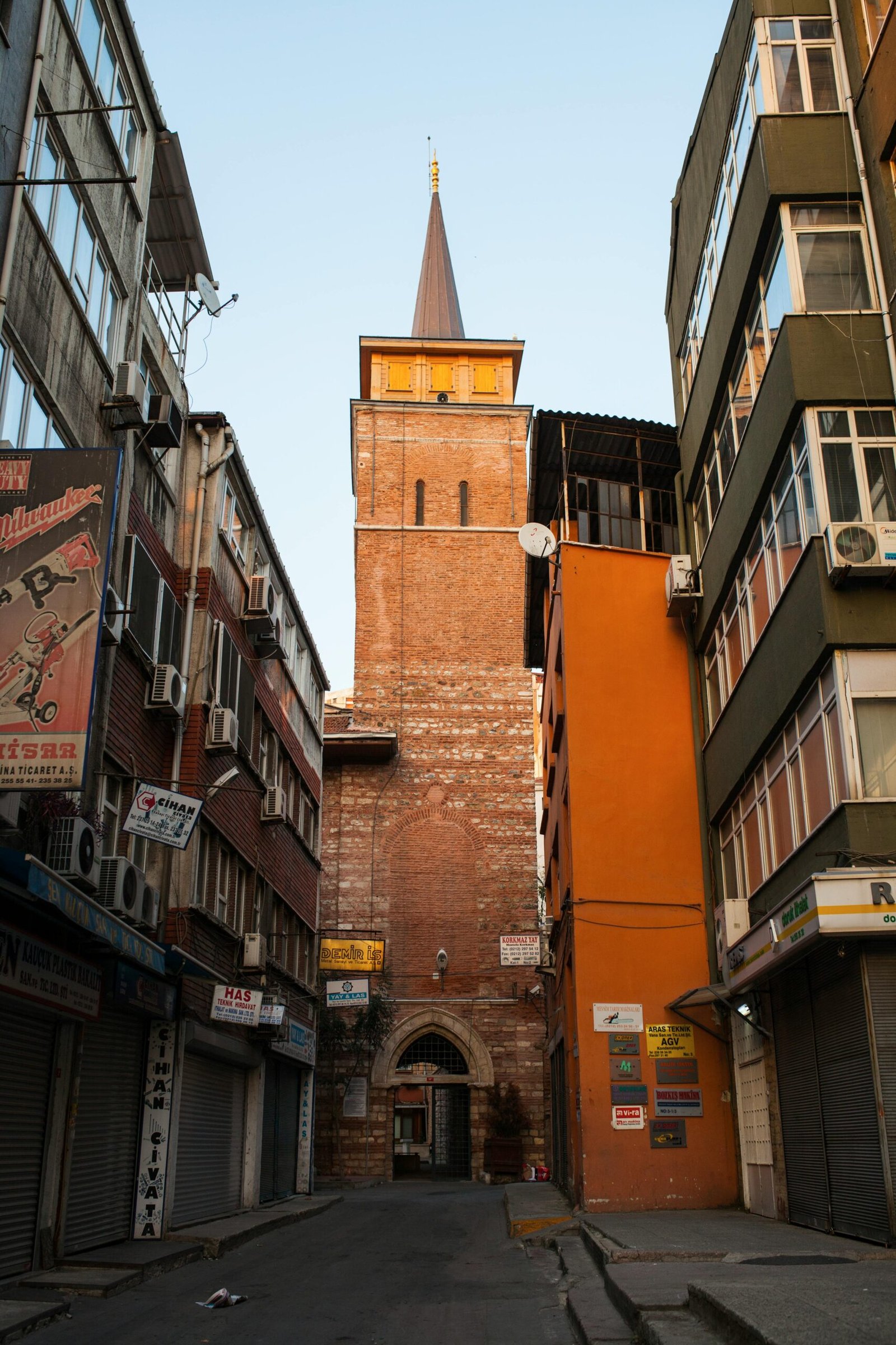 pexels-photo-2036693-2036693 View of a historic tower nestled between narrow streets in Istanbul, showcasing unique architecture.