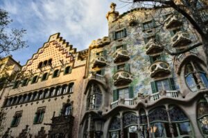 Stunning showcase of Gaudí's Casa Batlló, a modernist landmark in sunny Barcelona.