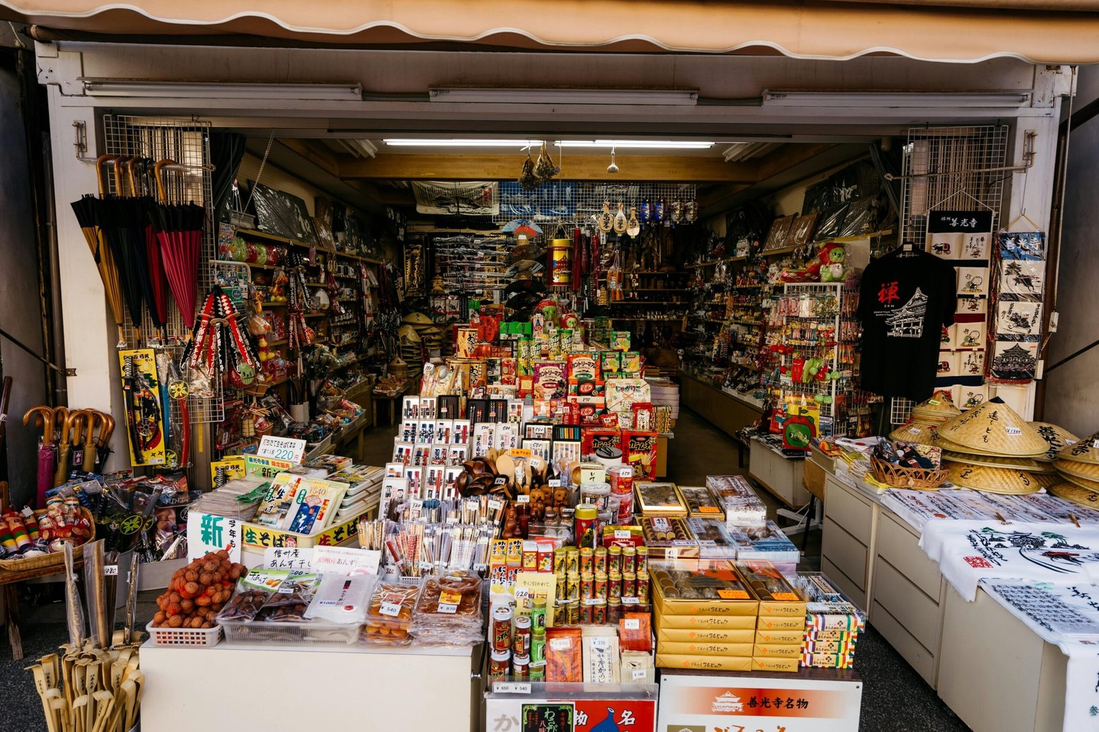 pexels-photo-2862039-2862039 Vibrant market stall with diverse products in Nagano, Japan, showcasing traditional Japanese items.