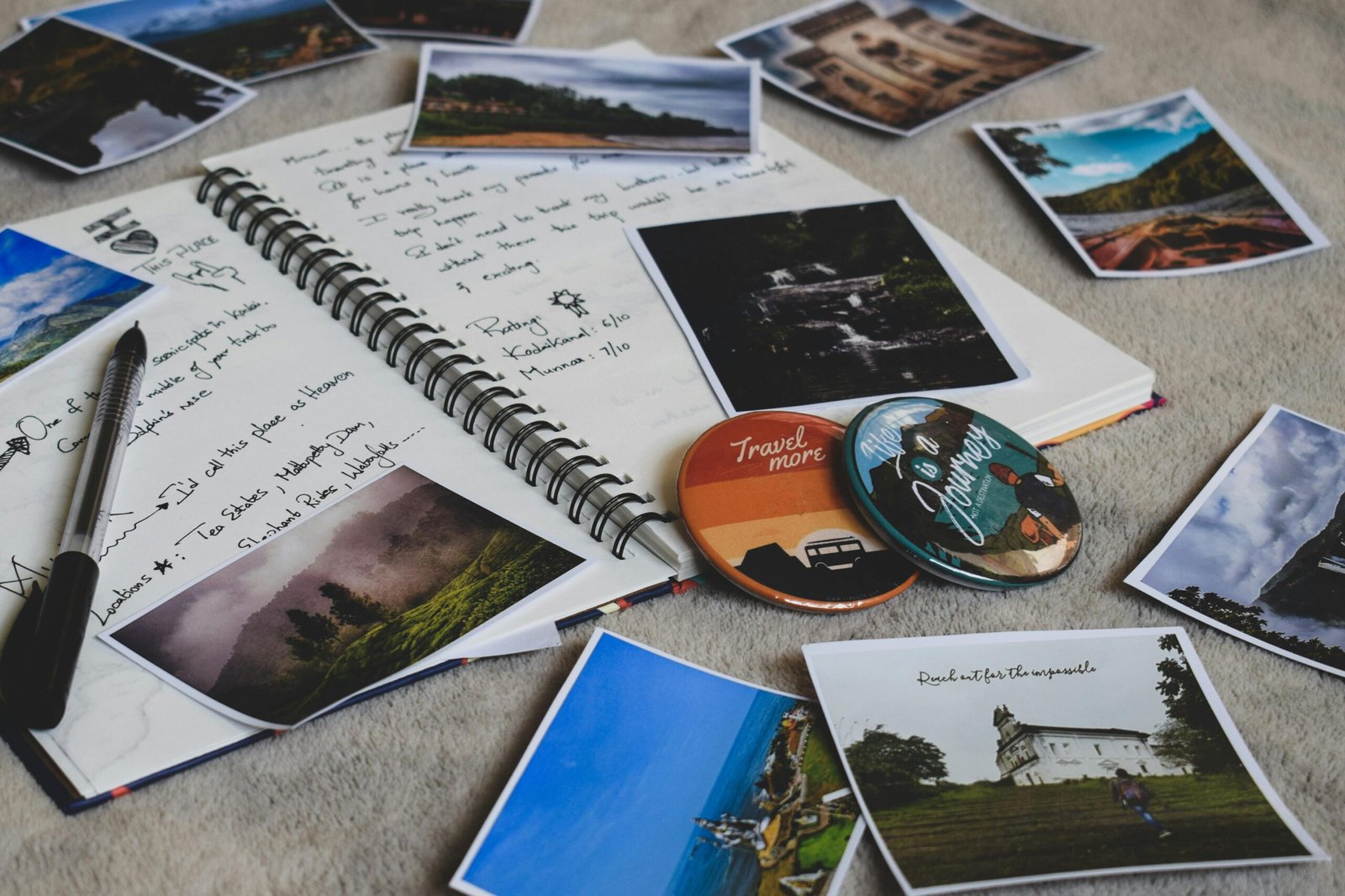 pexels-photo-2874998-2874998 Travel diary surrounded by printed photos and a pen, capturing memories creatively.