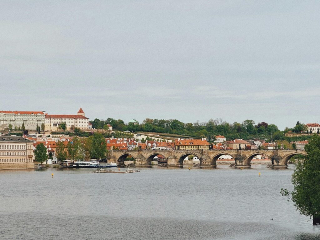 pexels-photo-31878123-31878123 Scenic view of the iconic Charles Bridge spanning the Vltava River in Prague, Czech Republic.