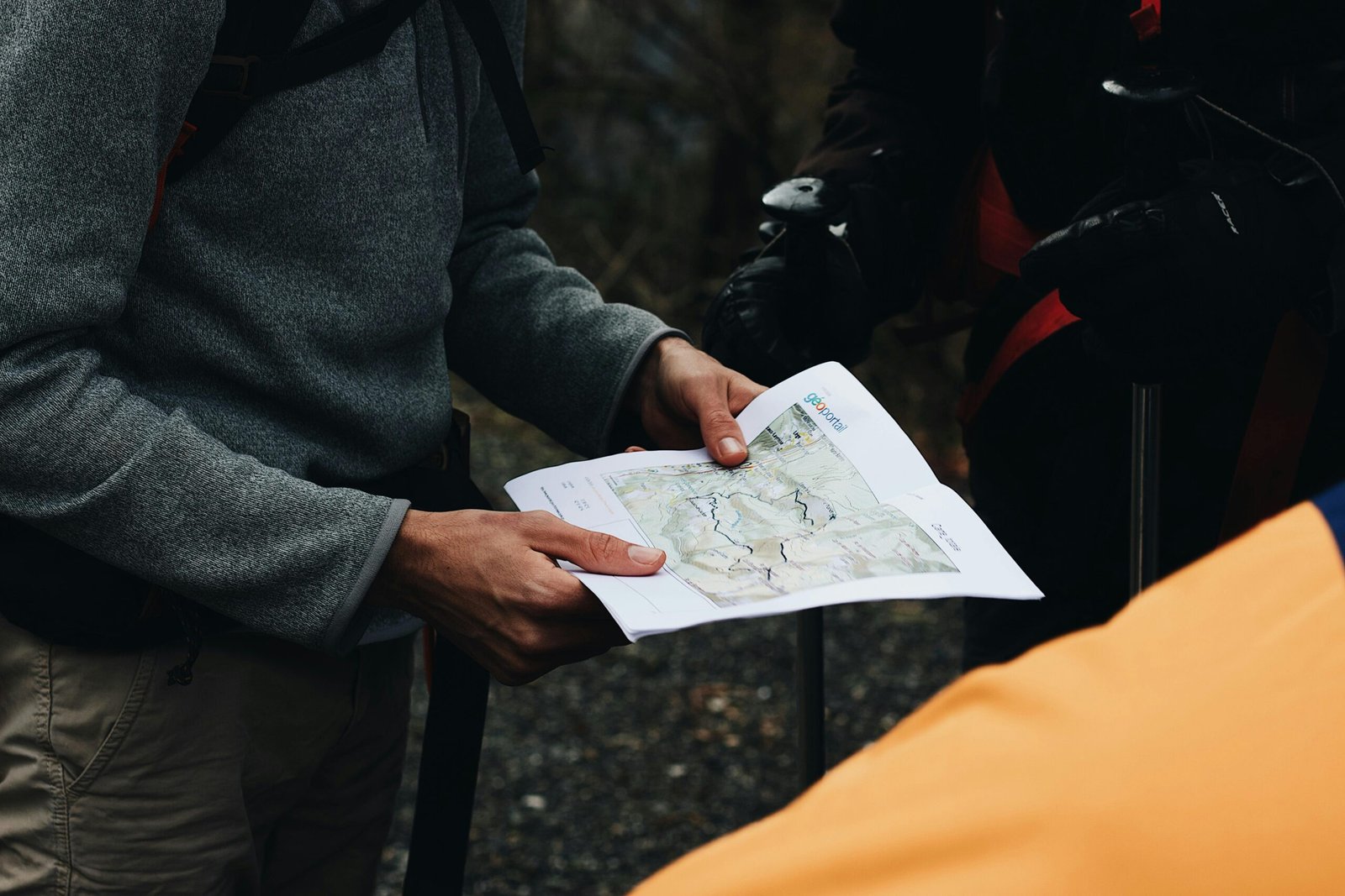 pexels-photo-3604968-3604968 Group of hikers planning their route with a map during an outdoor adventure.