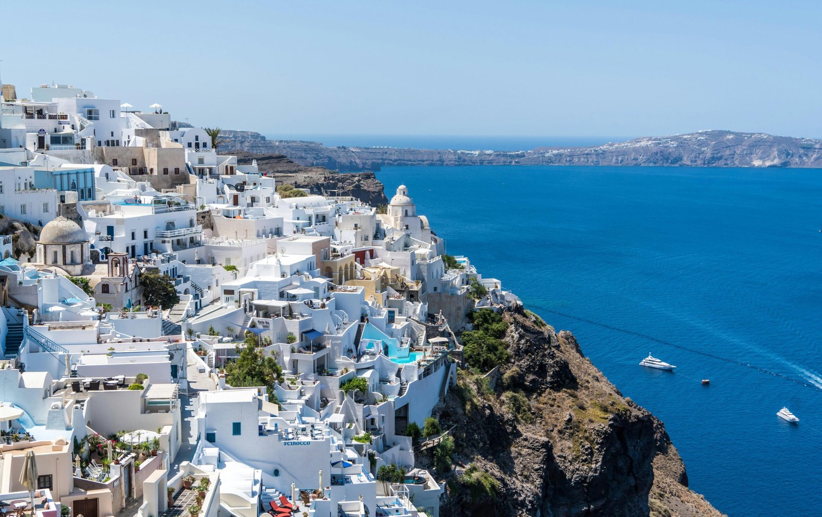 santorini-oia-greece-water-161815-161815-1 Beautiful Santorini houses overlooking the Aegean Sea on a sunny day.