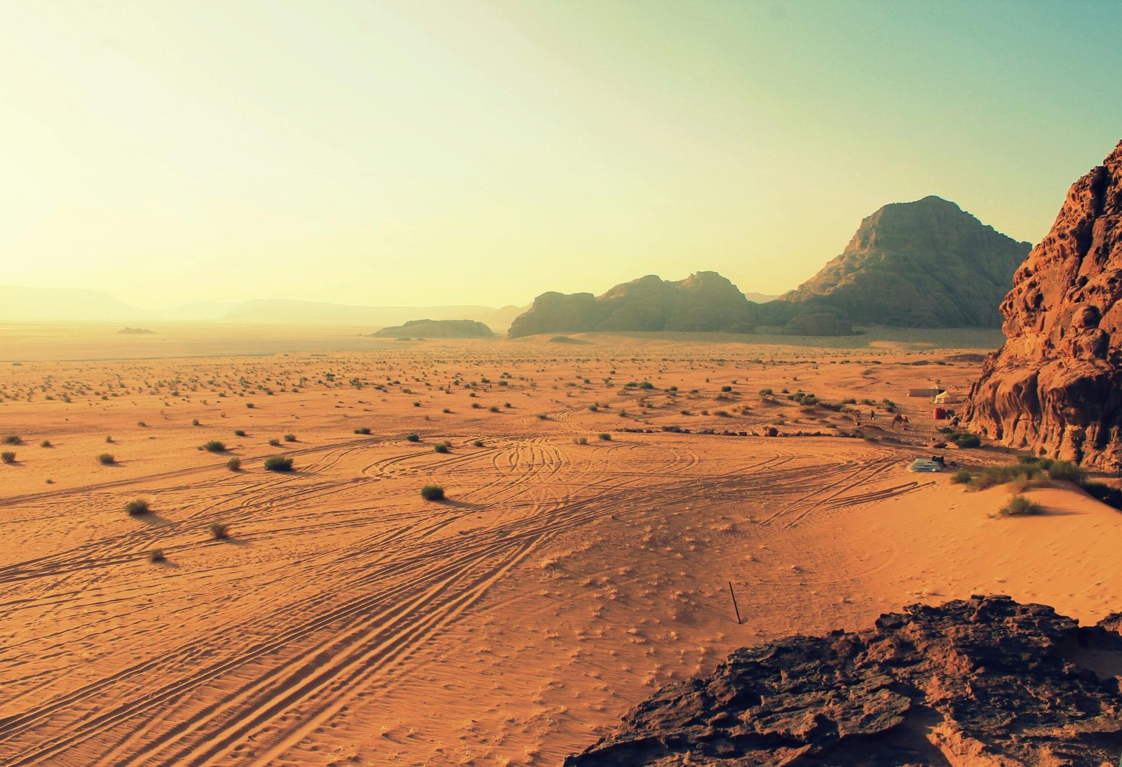 pexels-photo-106606-106606 Explore the stunning beauty of Wadi Rum's arid desert landscape, bathed in warm sunset hues.