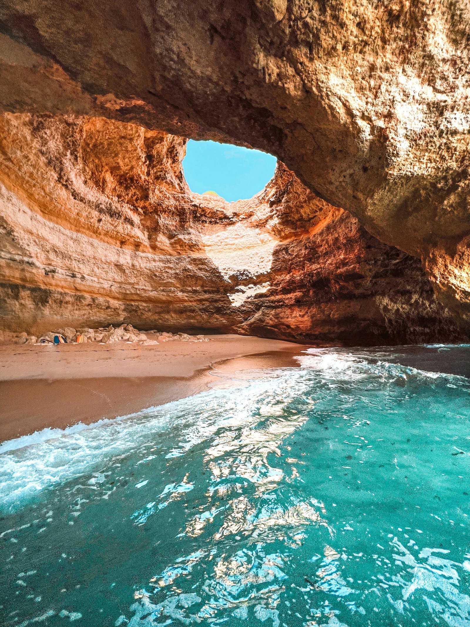 pexels-photo-12228100-12228100 Explore the stunning Benagil cave with its natural skylight and crystal clear waters in Algarve, Portugal.