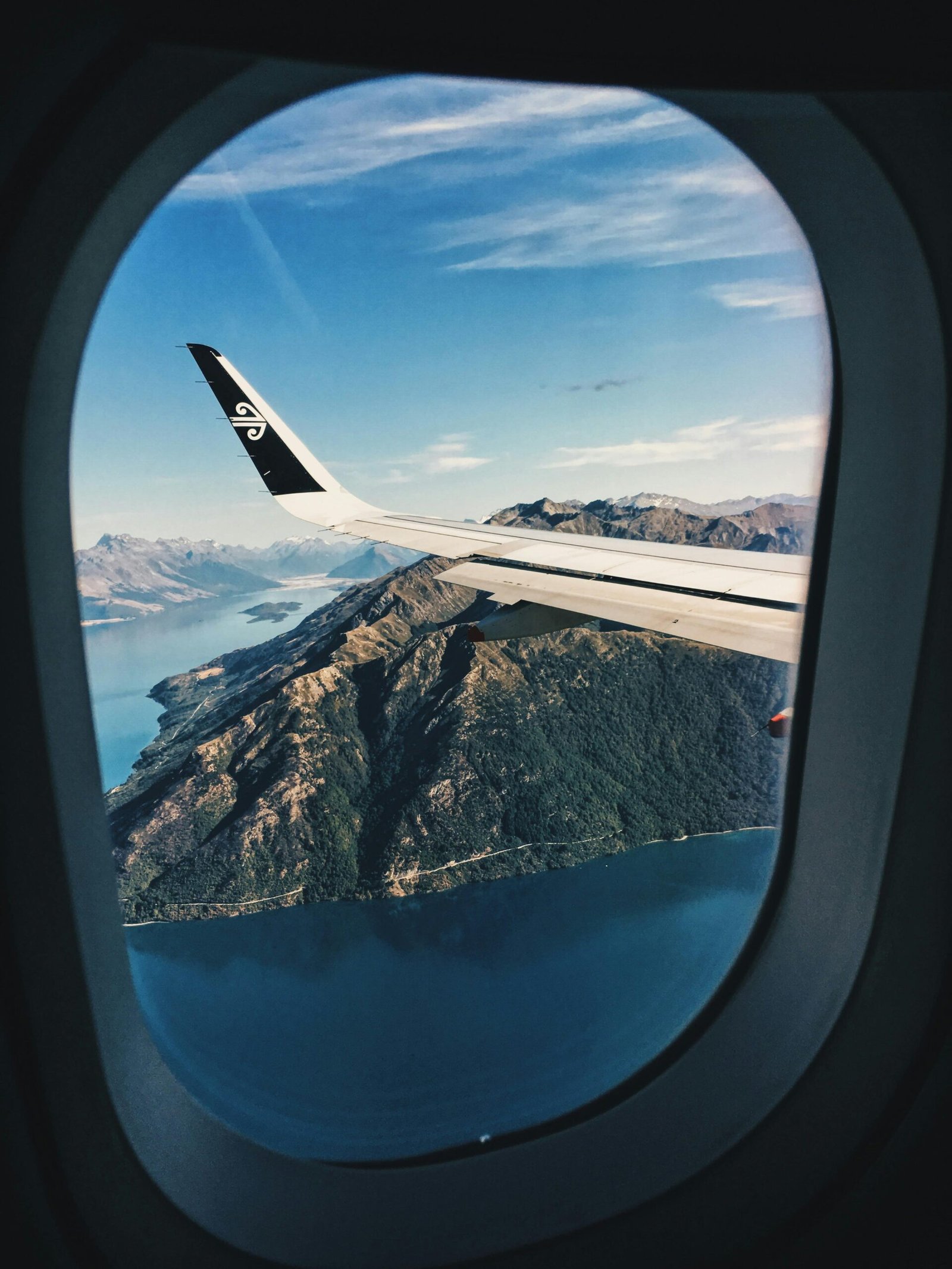 pexels-photo-2405101-2405101 Stunning aerial view of mountains and sea from an airplane window.