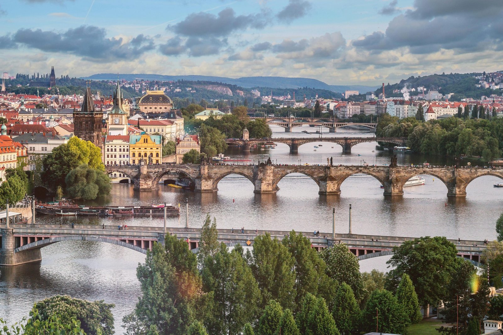 pexels-photo-442583-442583 Explore the breathtaking urban landscape of Prague featuring the iconic Charles Bridge over the Vltava River.