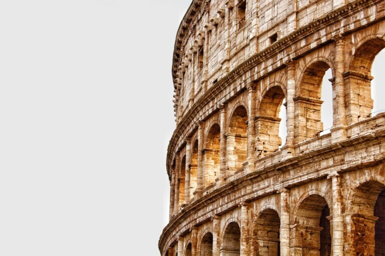 Detailed view of the Colosseum's arches in Rome, showcasing ancient Roman architecture.