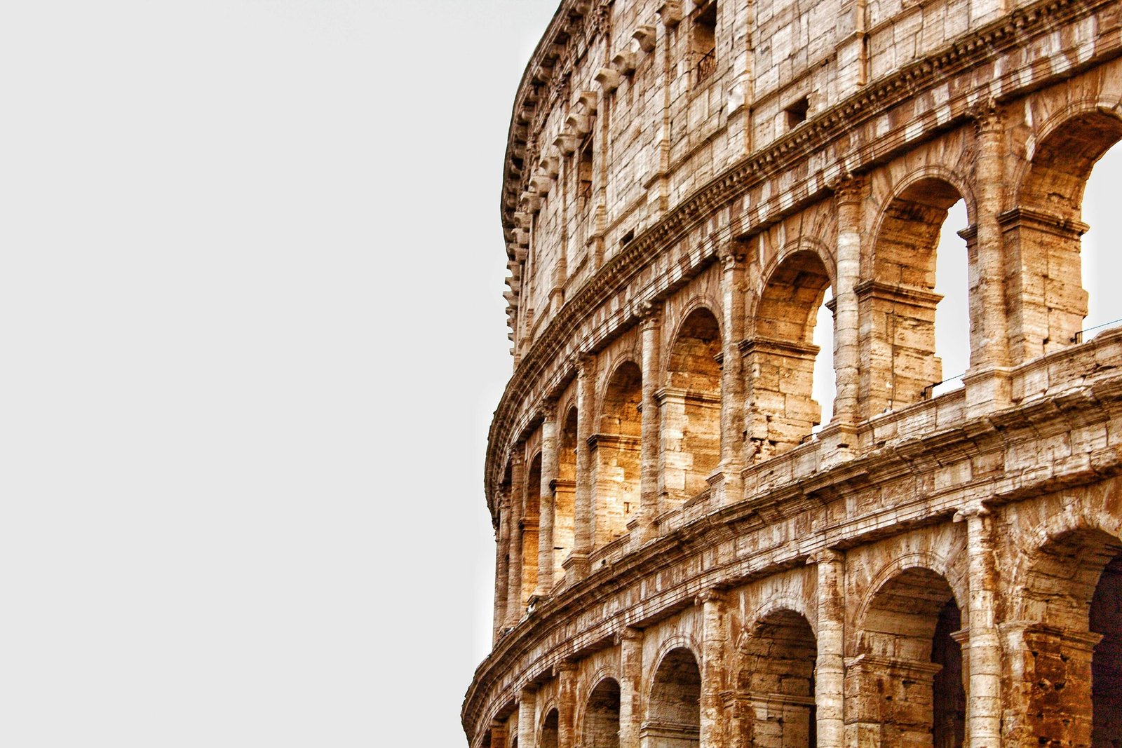 Detailed view of the Colosseum's arches in Rome, showcasing ancient Roman architecture.