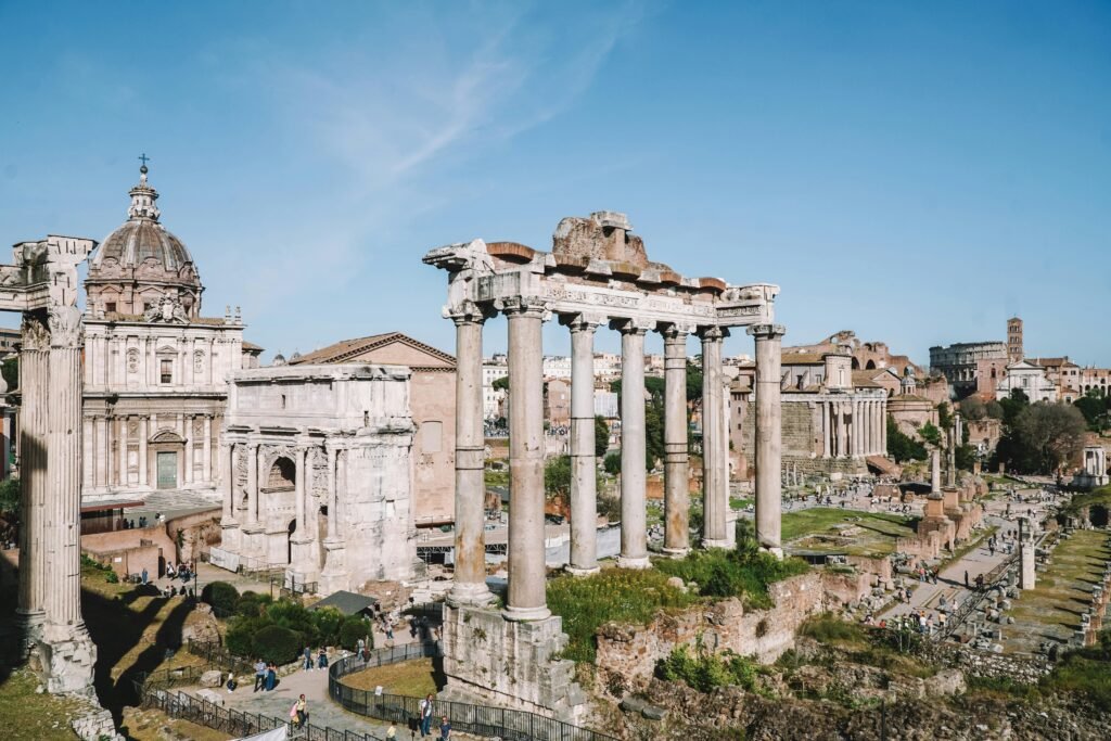 View of the historic ruins of the Roman Forum in Rome, Italy on a sunny day.
