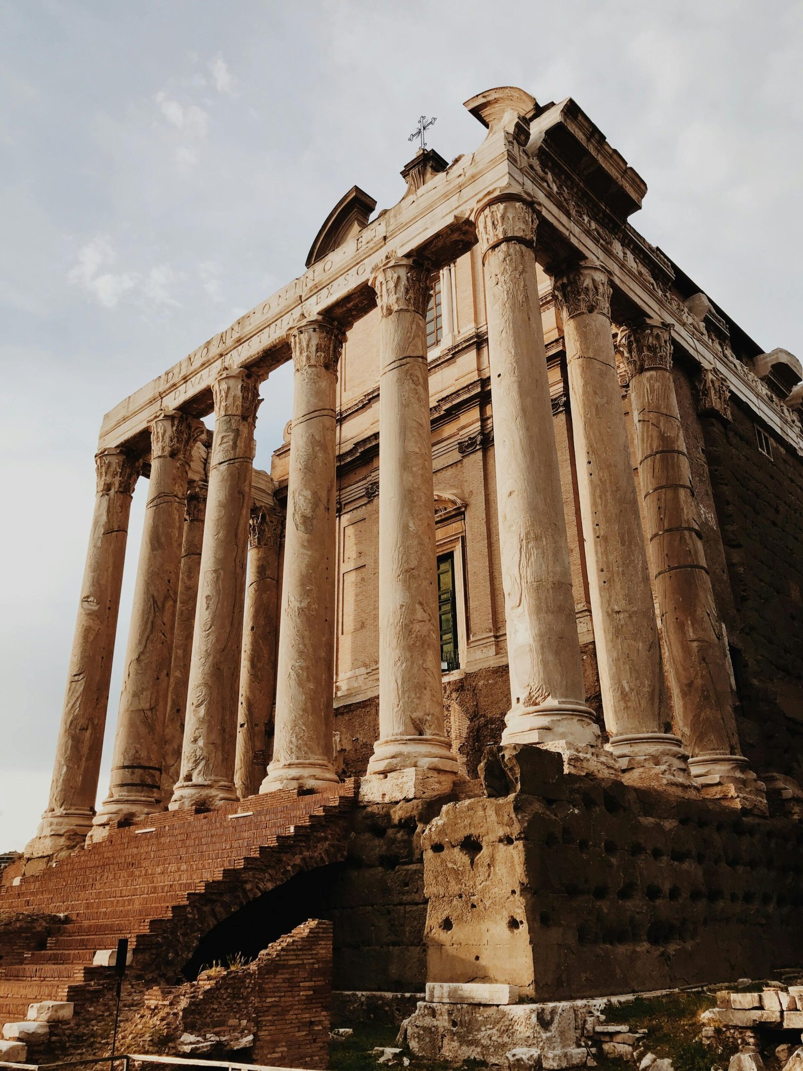Explore the ancient Roman Forum ruins with iconic columns, capturing historic architecture in Rome, Italy.