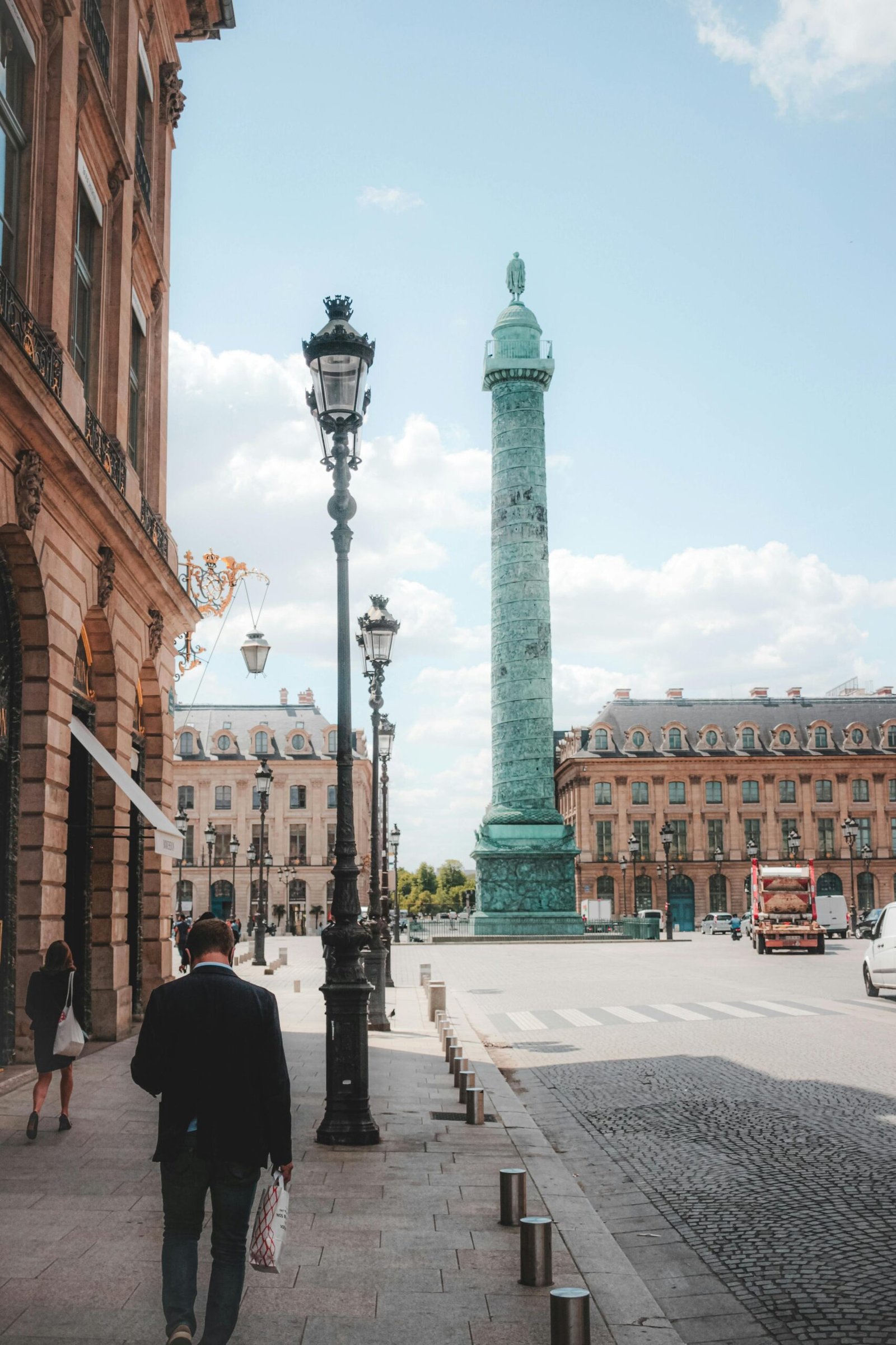 A sunny view of the Vendôme Column in Paris, capturing the historic architecture and urban scene.